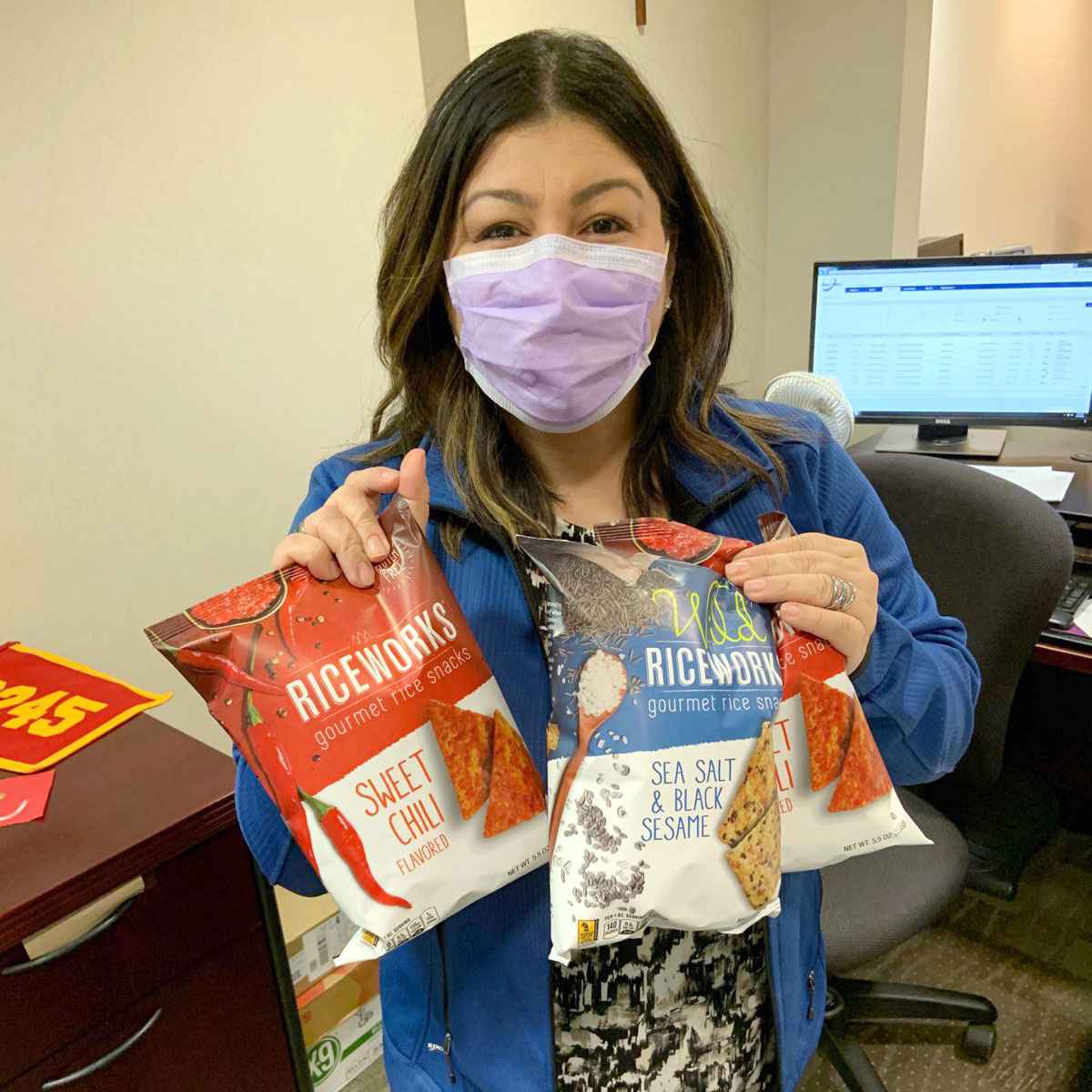 Nurse holding bags of Riceworks